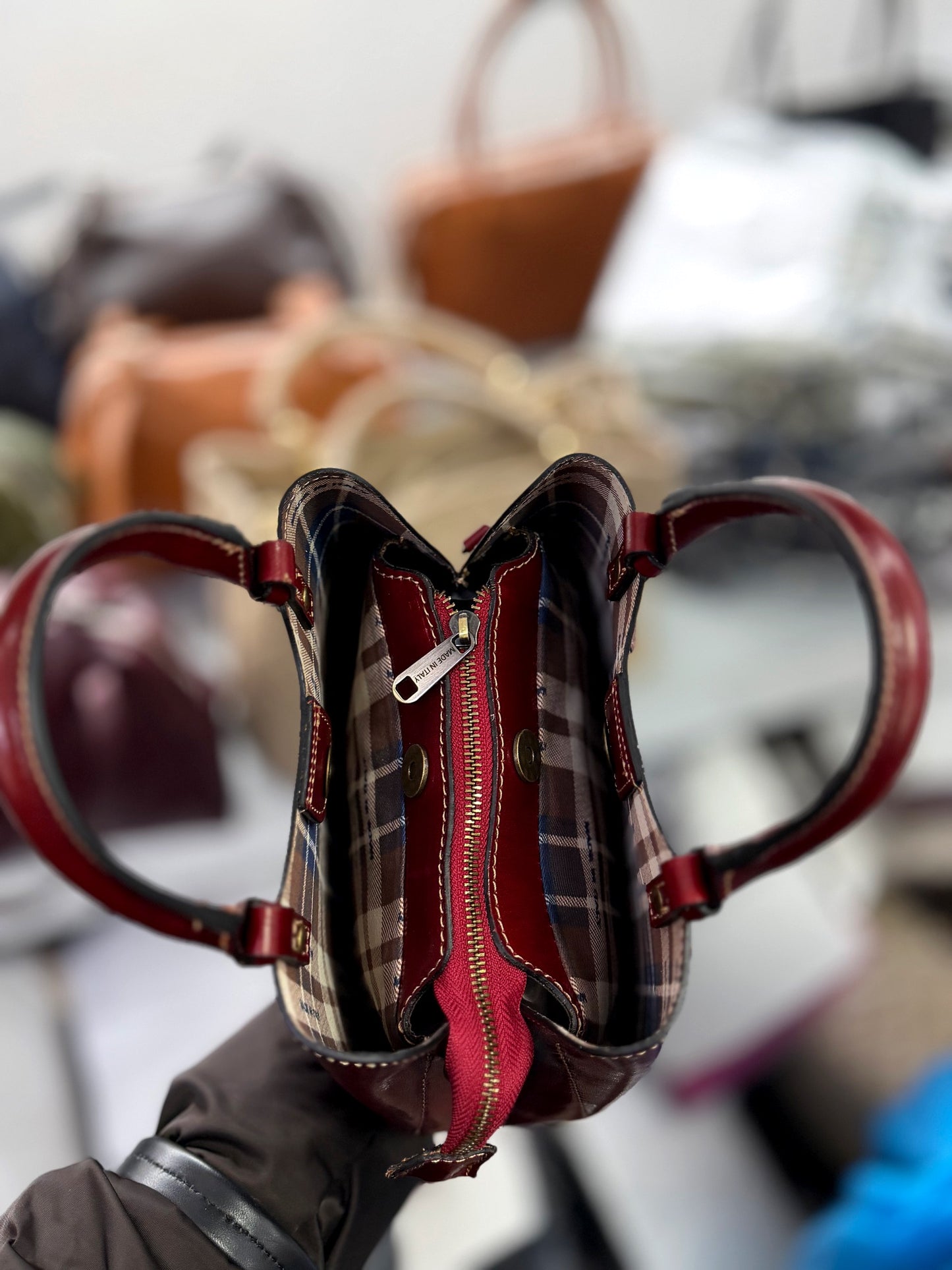 Structured Leather Top Handle Bag with Zip Closure and Shoulder Strap